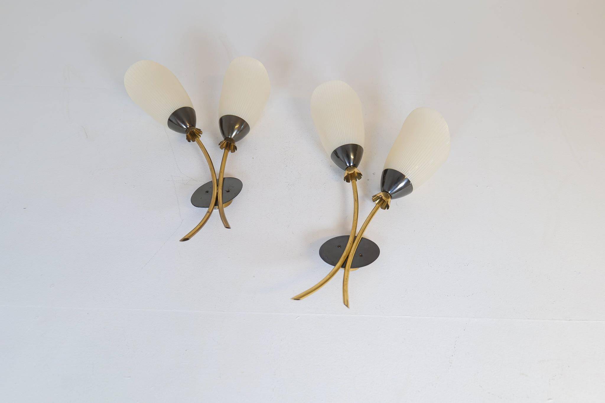 Mid-century pair of wall lamps in brass and opaline attributed to Asea Sweden, 1950s.