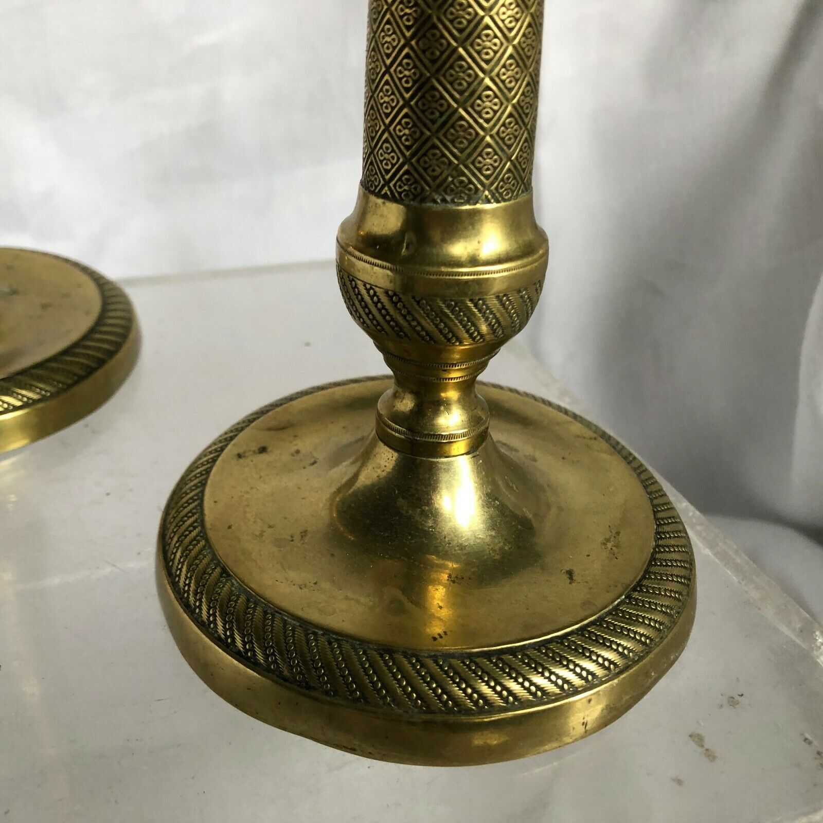 Pair of bronze and brass candlesticks
