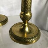 Pair of bronze and brass candlesticks