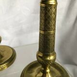 Pair of bronze and brass candlesticks