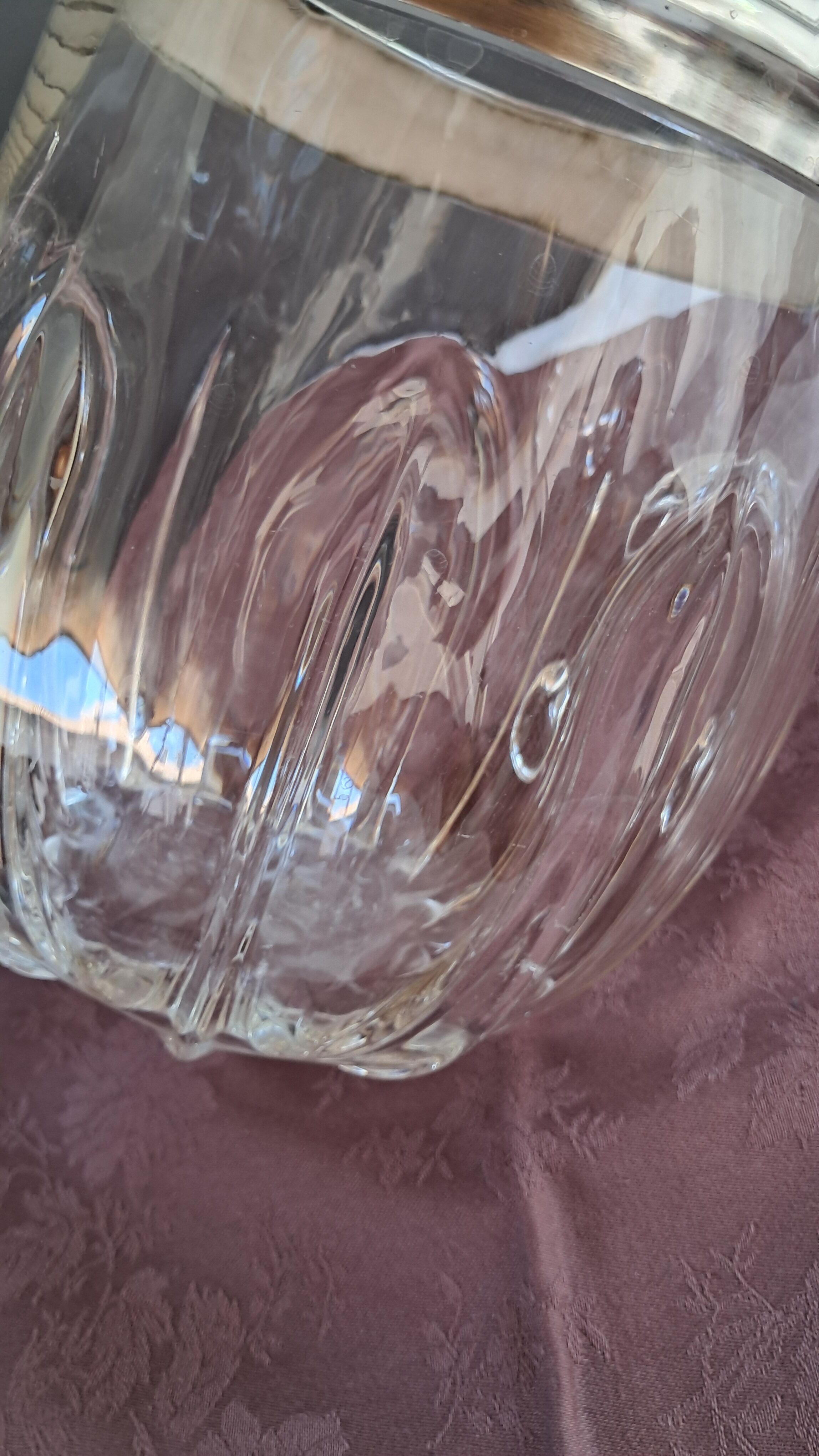 Twisted moulded glass bistro champagne bucket with a silver metal collar.