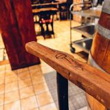 Antique bar stool with wooden seat