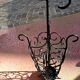 Antique wrought iron umbrella stand for entrance hall, vintage decor.