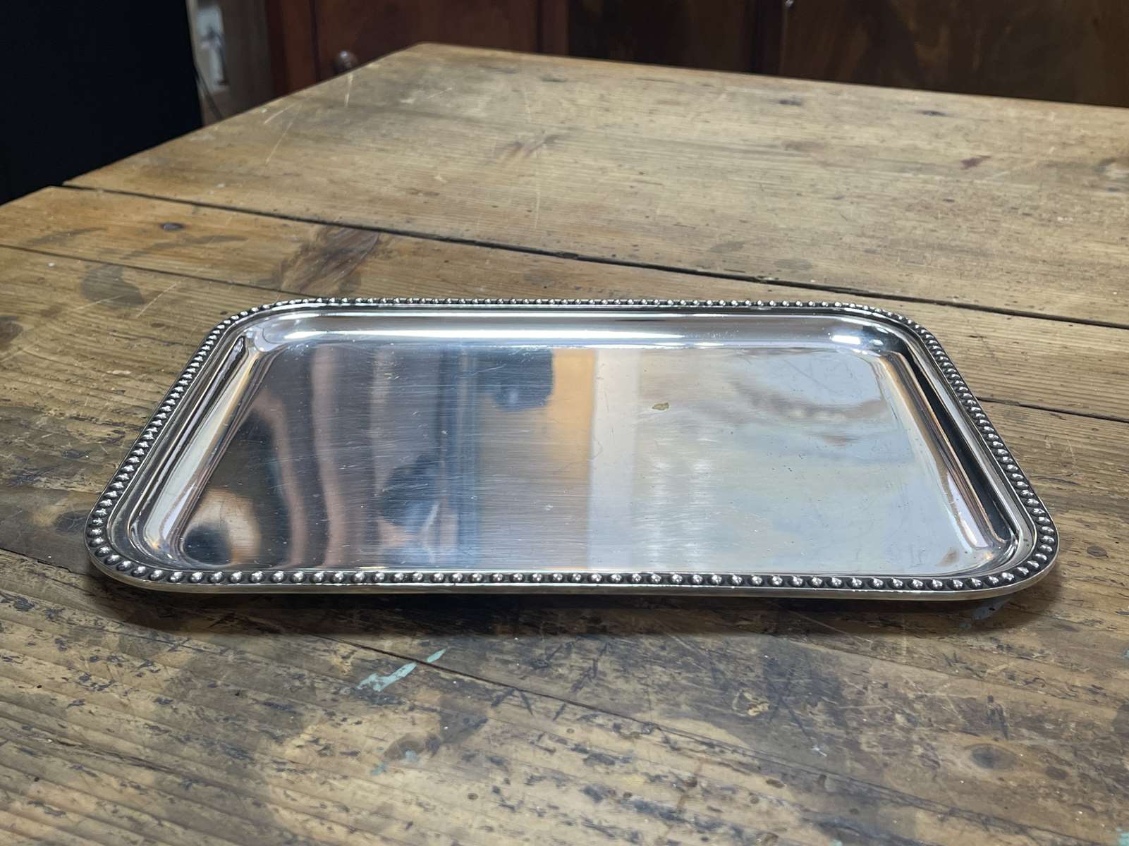 Small rectangular and beaded silver metal top