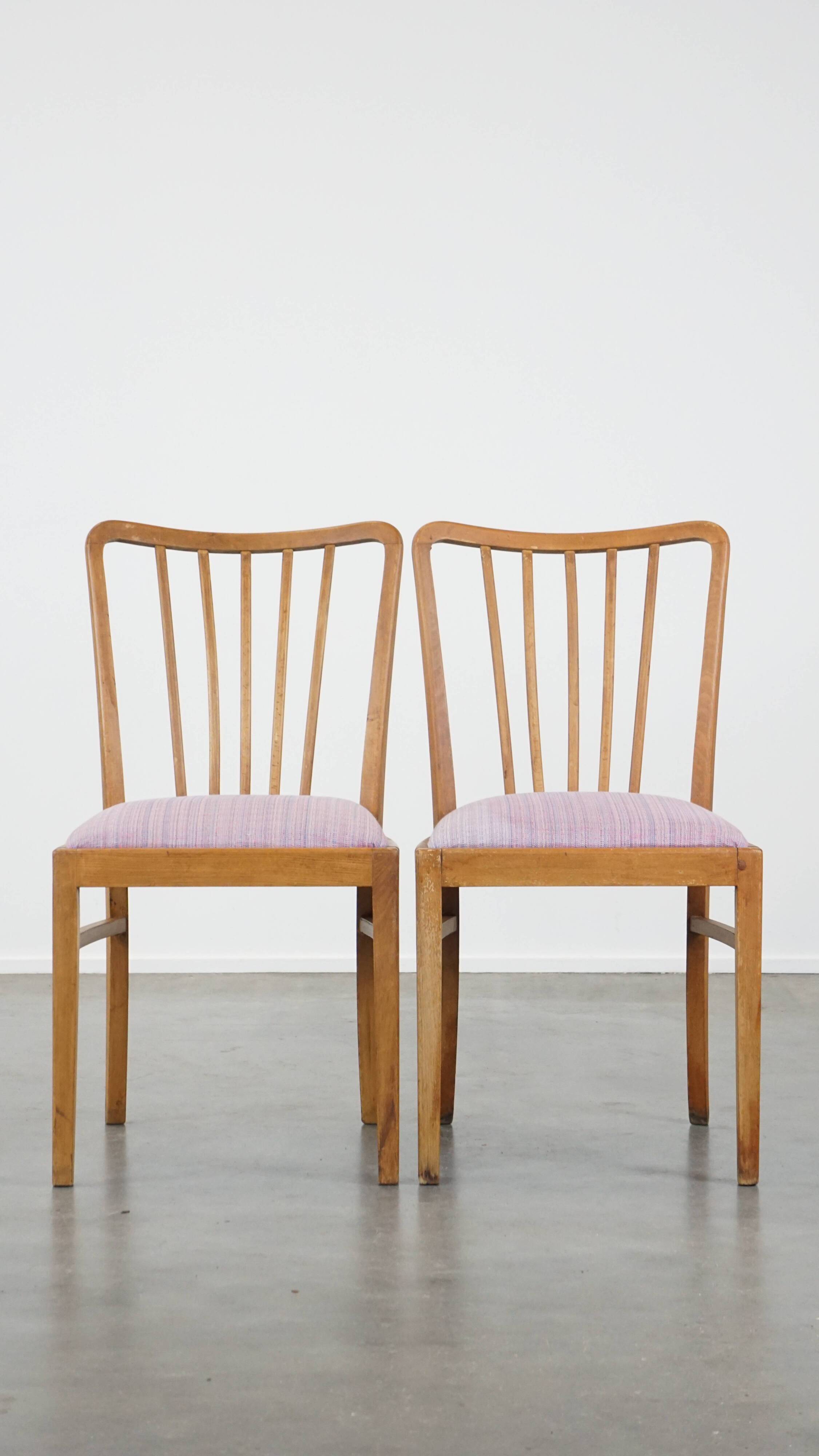 Set of 2 vintage dining chairs from the 1970s with spindle backrest and fabric seat