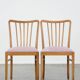 Set of 2 vintage dining chairs from the 1970s with spindle backrest and fabric seat