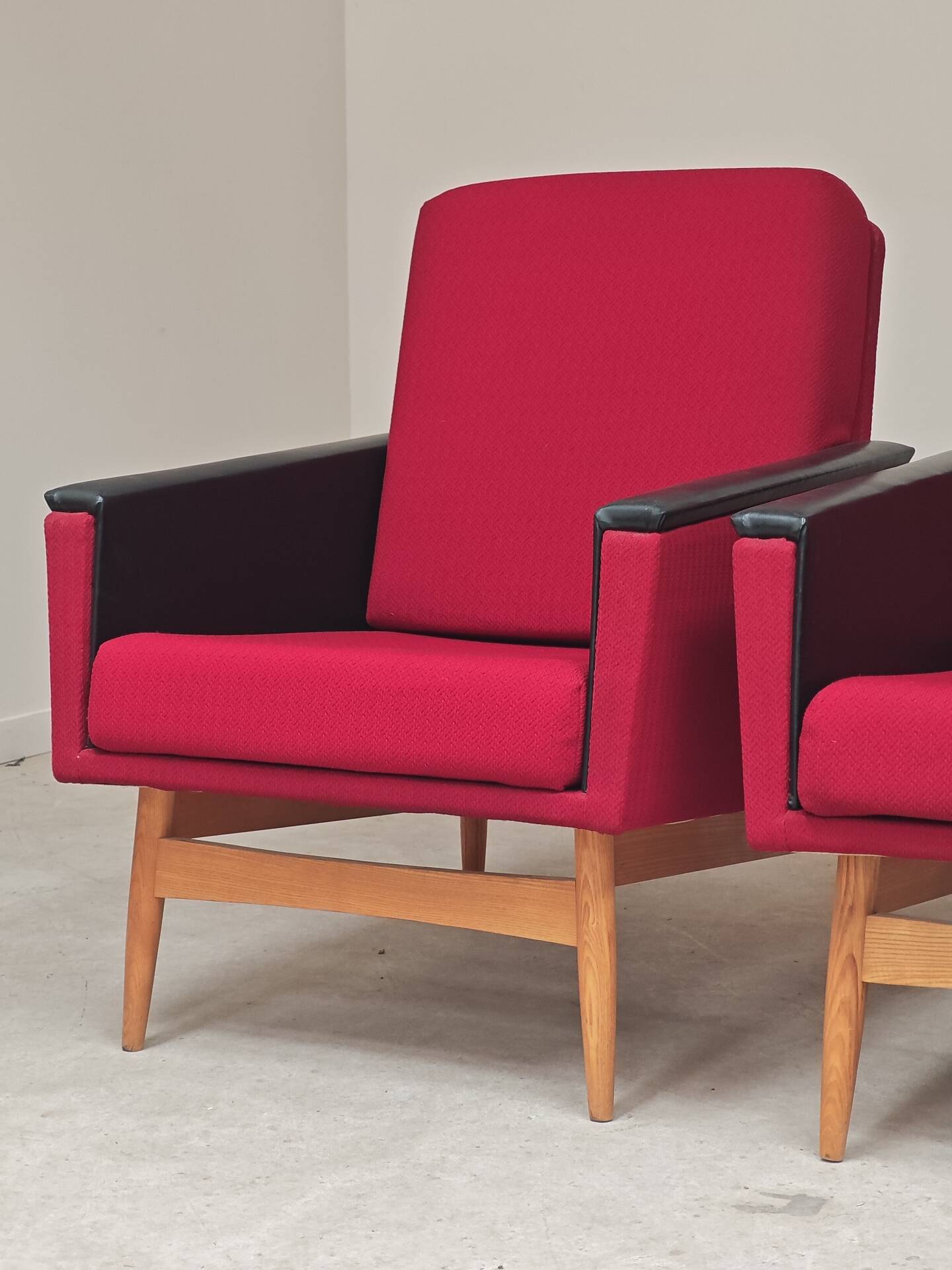 Pair of Drevotex Zamberk armchairs, red fabric and faux leather 1970