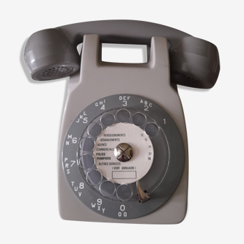 Wall telephone with dial with amplifier