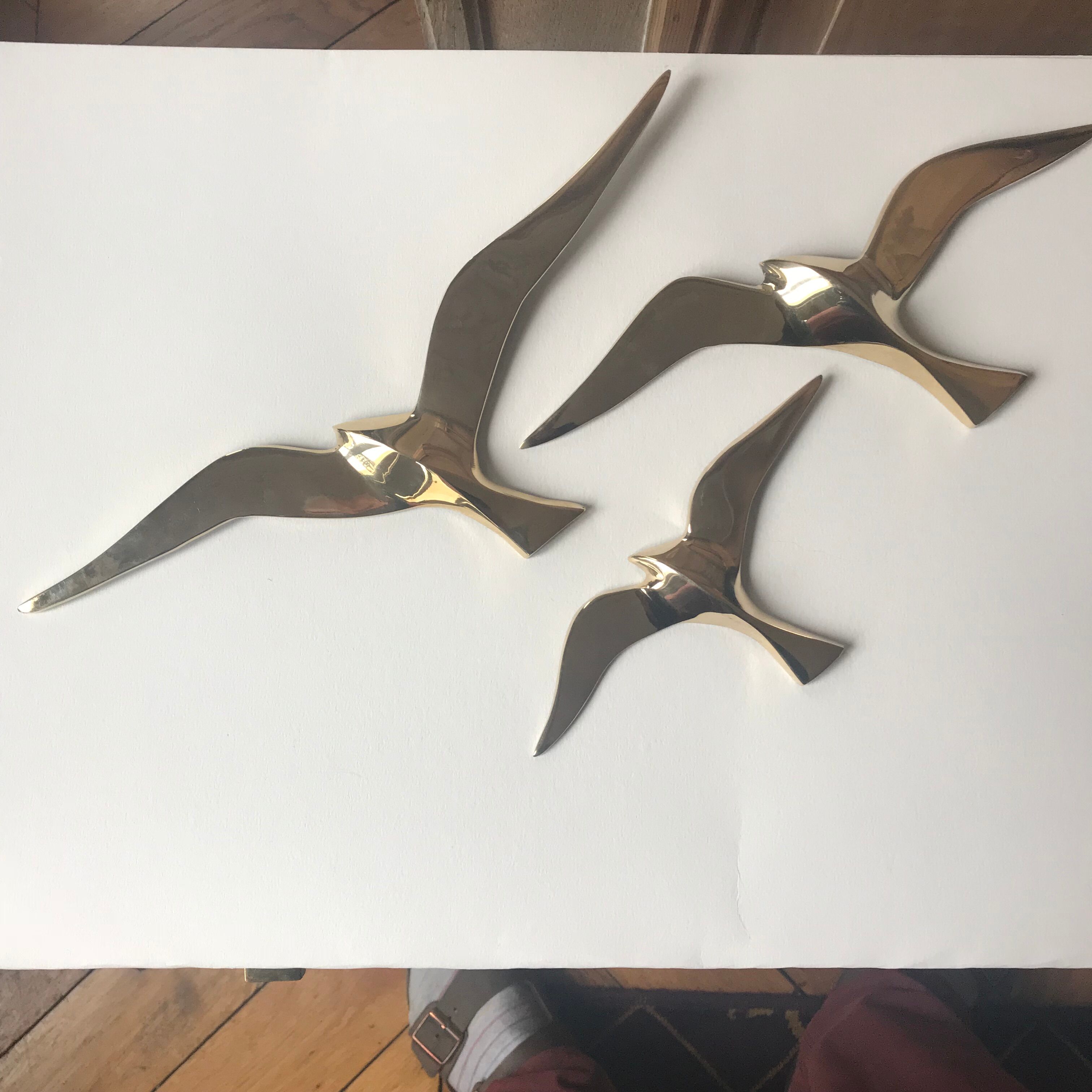 Trio of brass birds