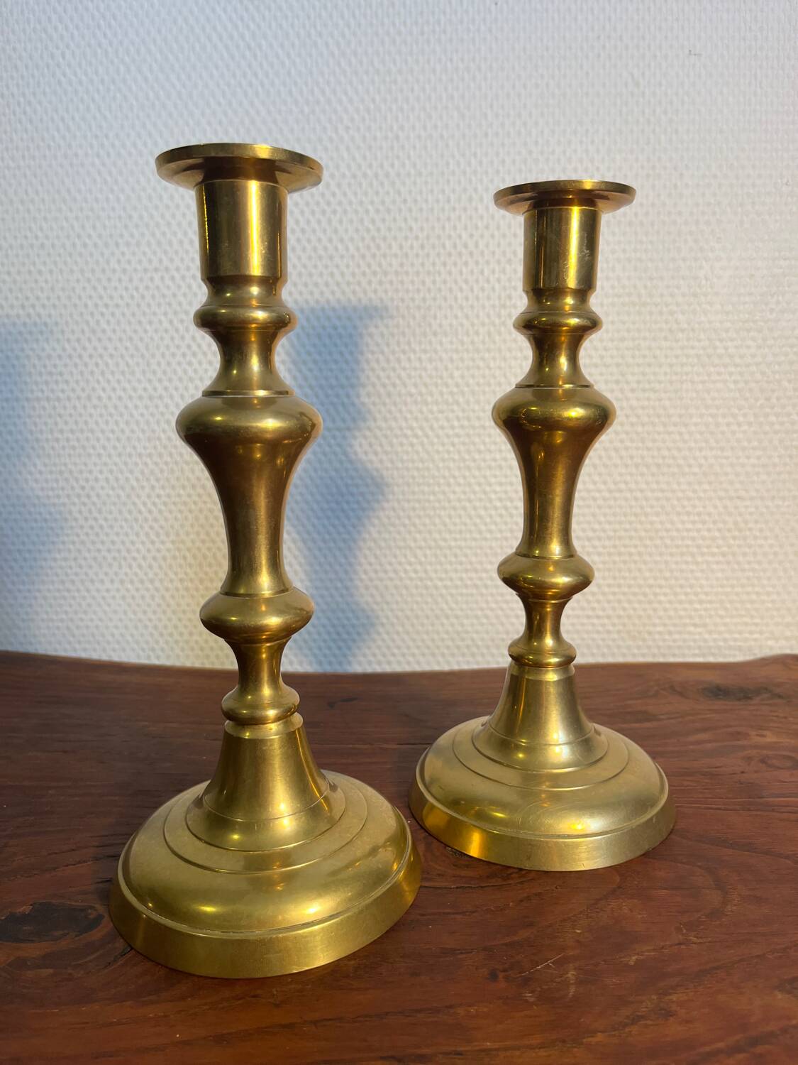 Pair of duo of ringed brass candlesticks