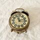 Small alarm clock old vintage watch in copper brass