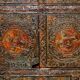 Antique polychrome Tibetan altar cabinet with deer and flowers.