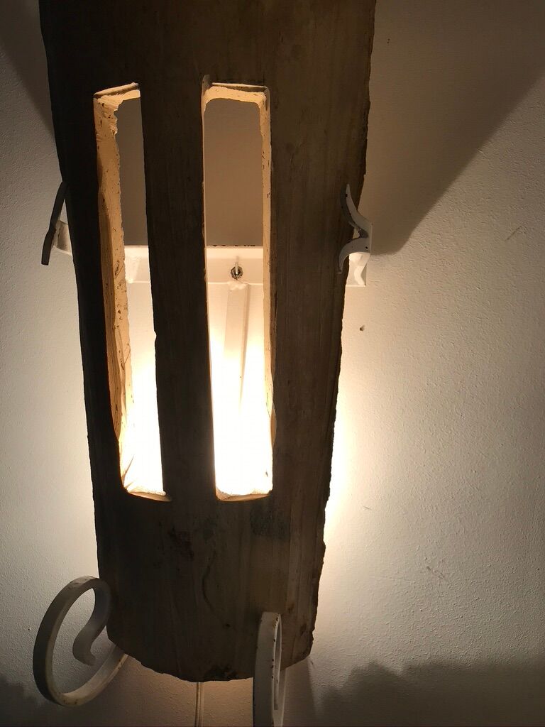 Lot of three terracotta and wrought iron appliques