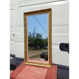 Wooden mirror and gold trim