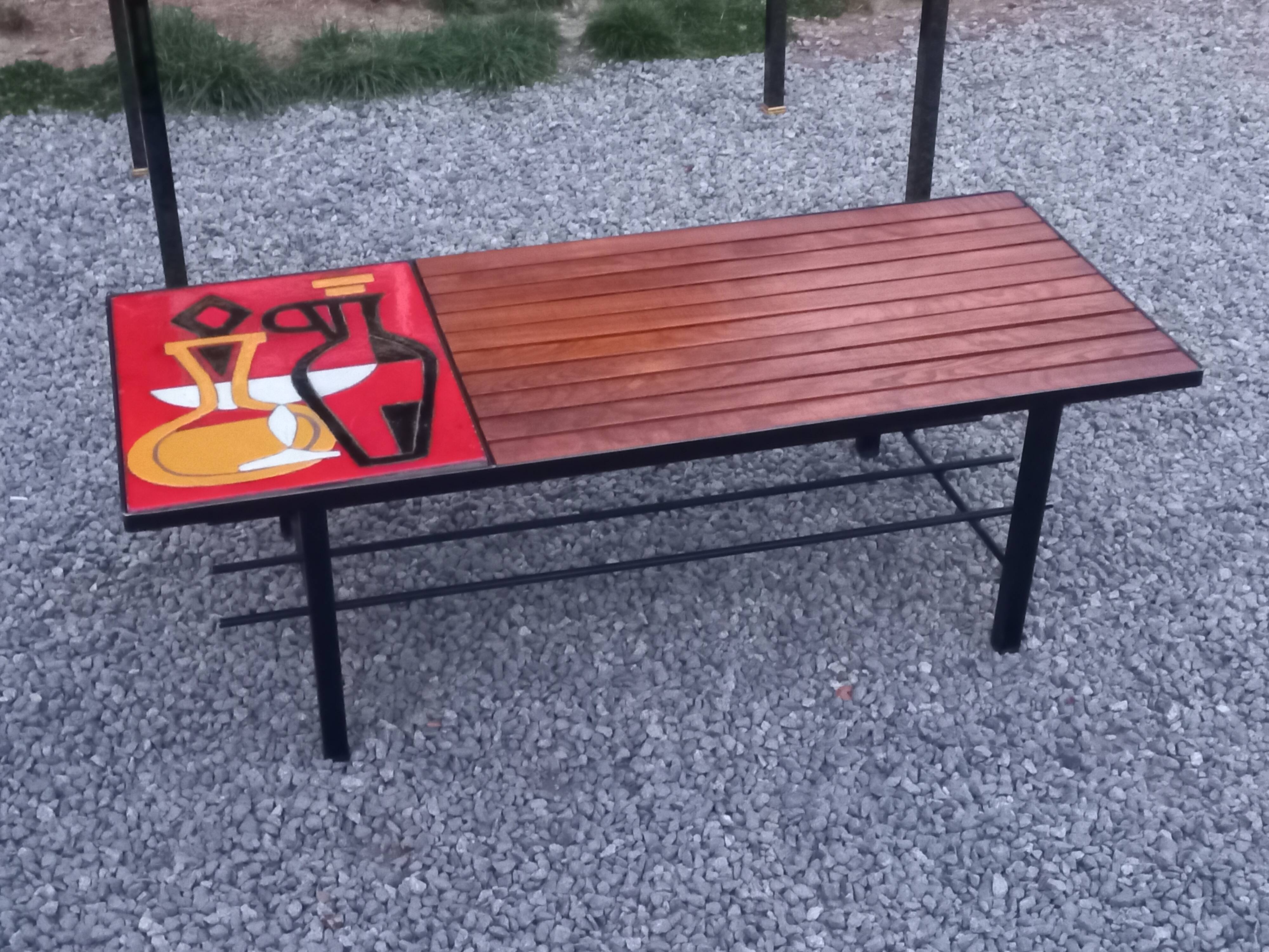 1970s design coffee table with ceramic and wood top, metal legs.