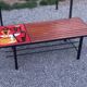 1970s design coffee table with ceramic and wood top, metal legs.