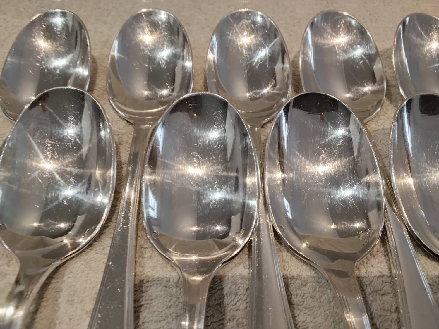 12 silver-plated soup spoons by Christofle America