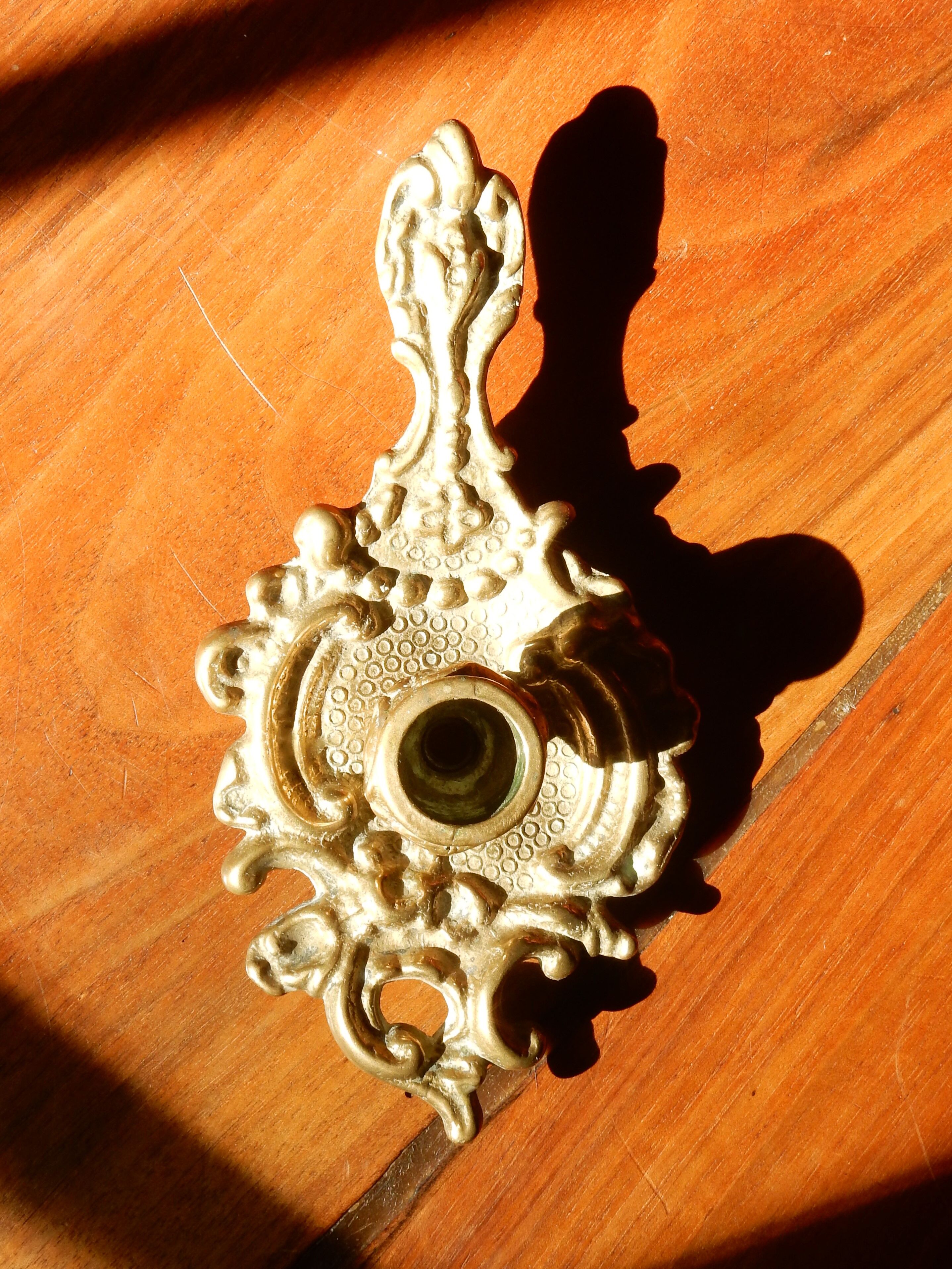 Bronze hand candle holder, cellar rat