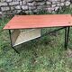 Table basse teck avec porte revue années 60