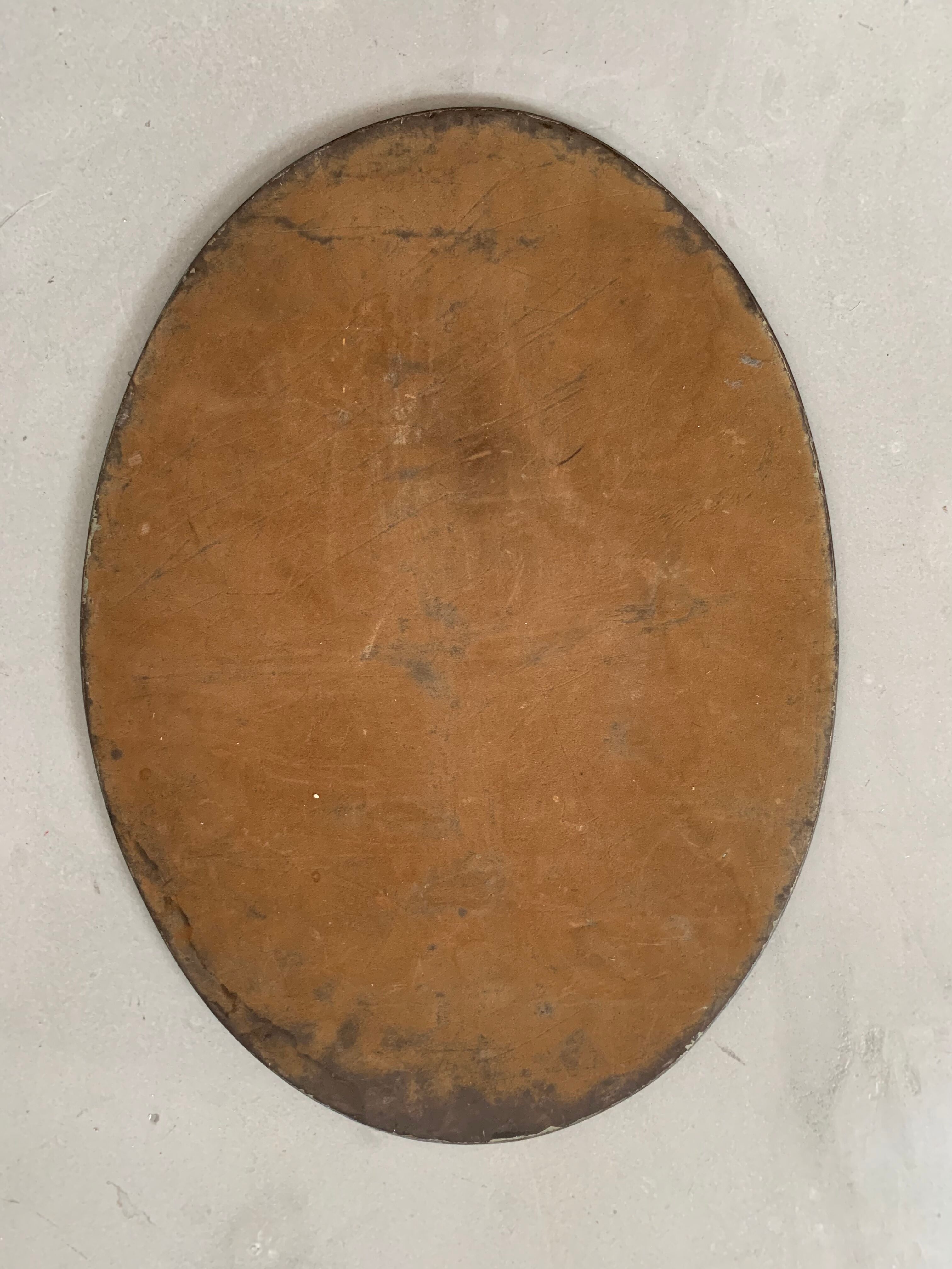 Old beveled oval mirror