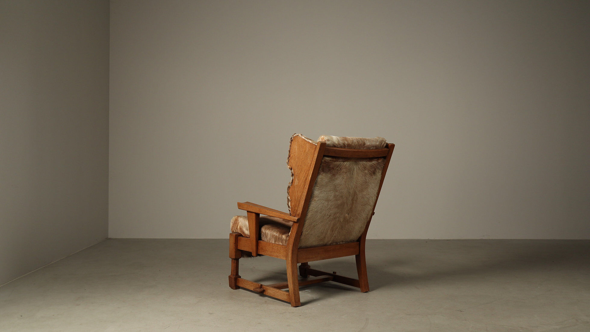Brutalist oak lounge chair and ottoman in original goat hide, 1960s
