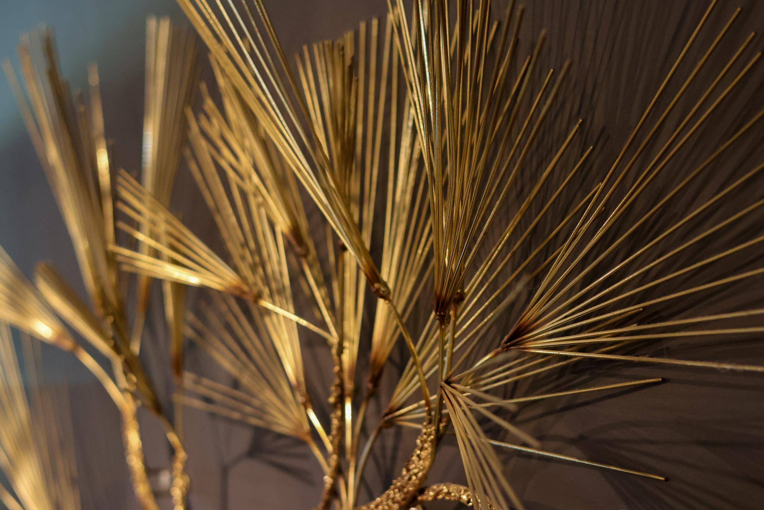 Large wall sculpture in the shape of a tree needle in brass by Curtis Jeré, mid-century modern.