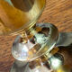 Set of candlesticks and tubular vases in solid brass.