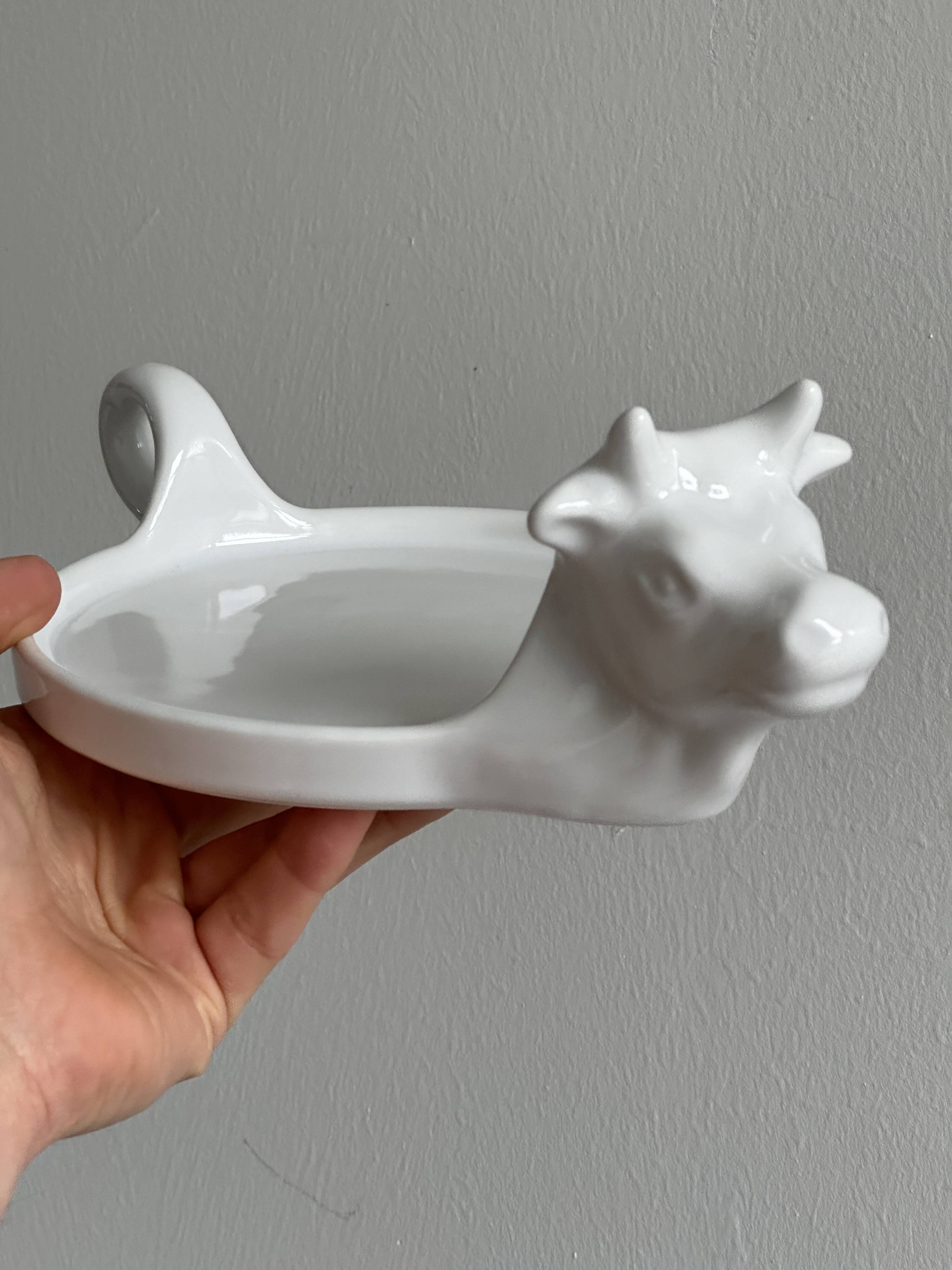 White porcelain cheese dish with handle and cow's head