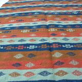 Authentic handmade Tunisian Berber kilim rug in orange wool.