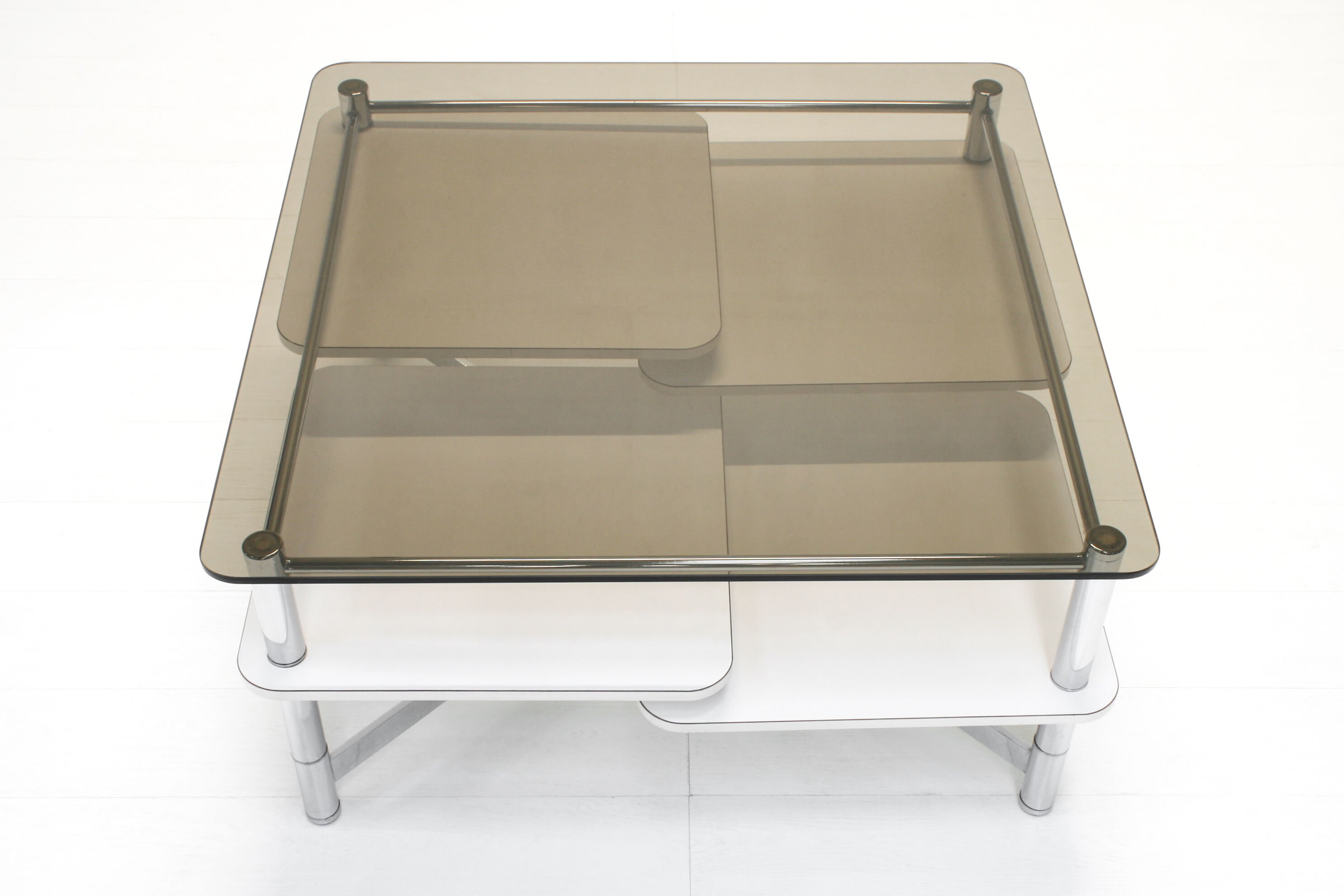 Vintage 1970s smoked glass swivel platform coffee table