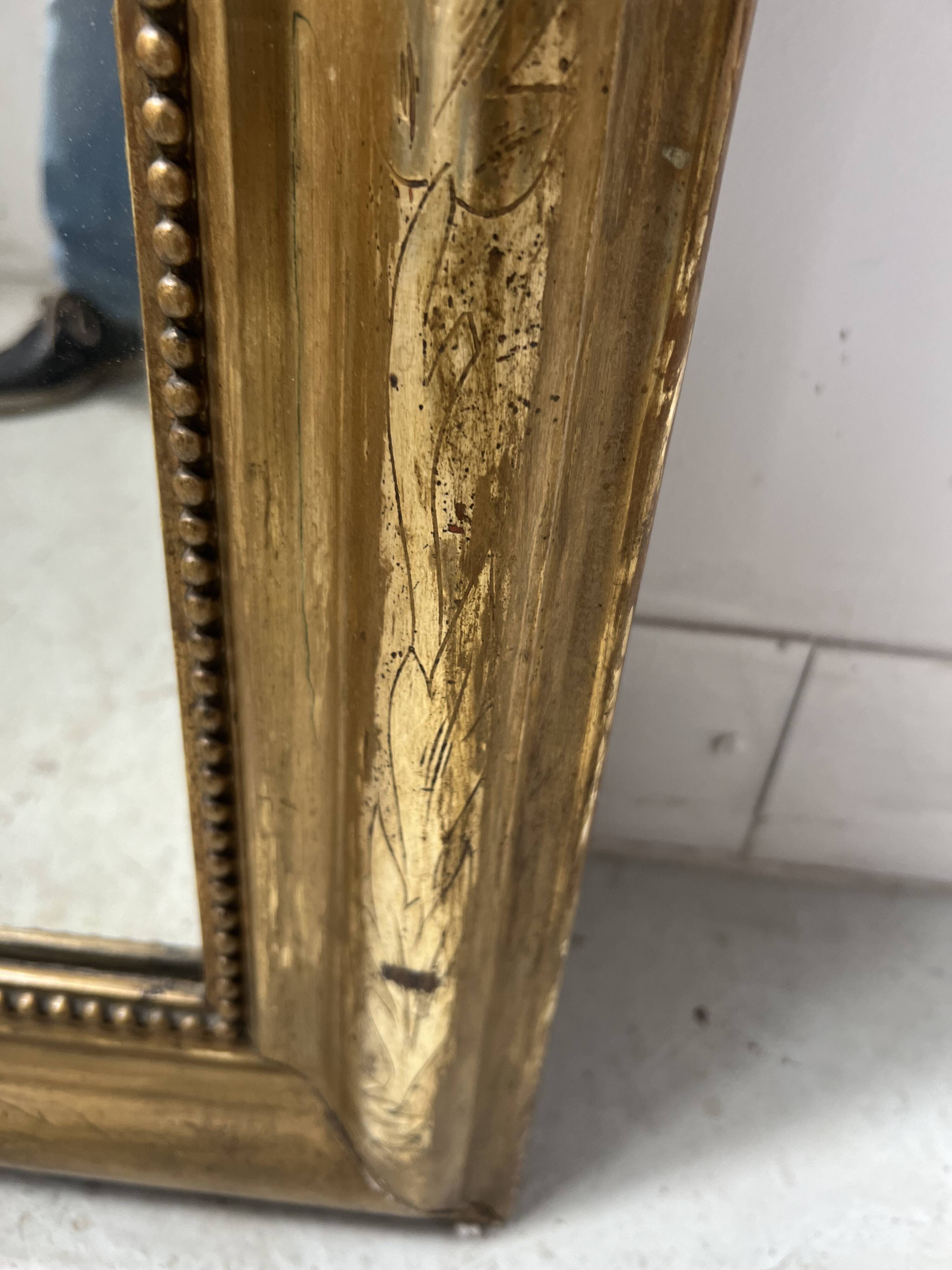 Louis Philippe mirror in wood and gilded stucco, 19th century