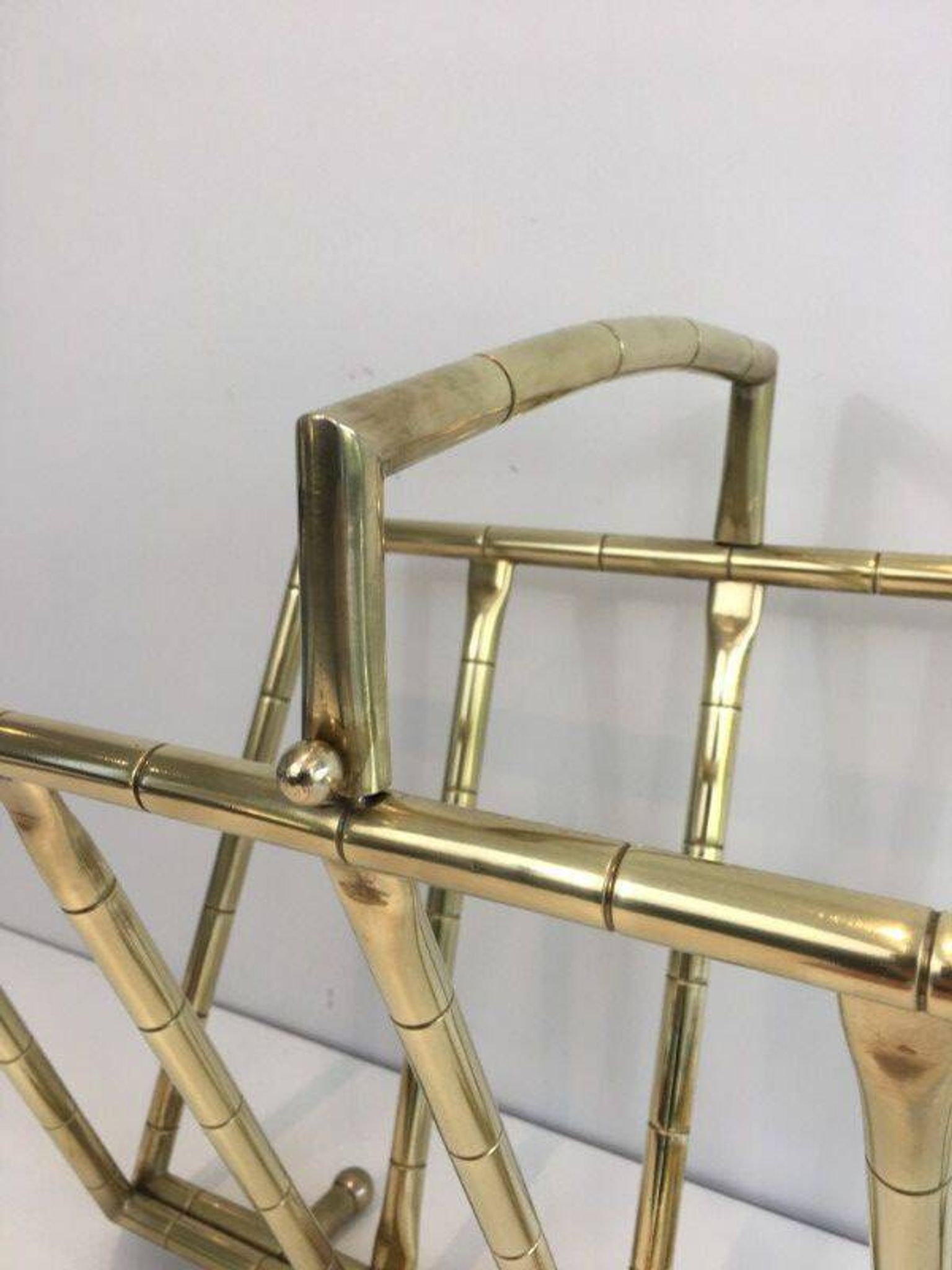 Brass faux-bamboo style magazine rack