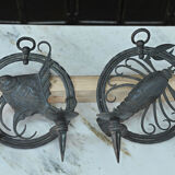 Pair of carved metal wall lamps signed RG