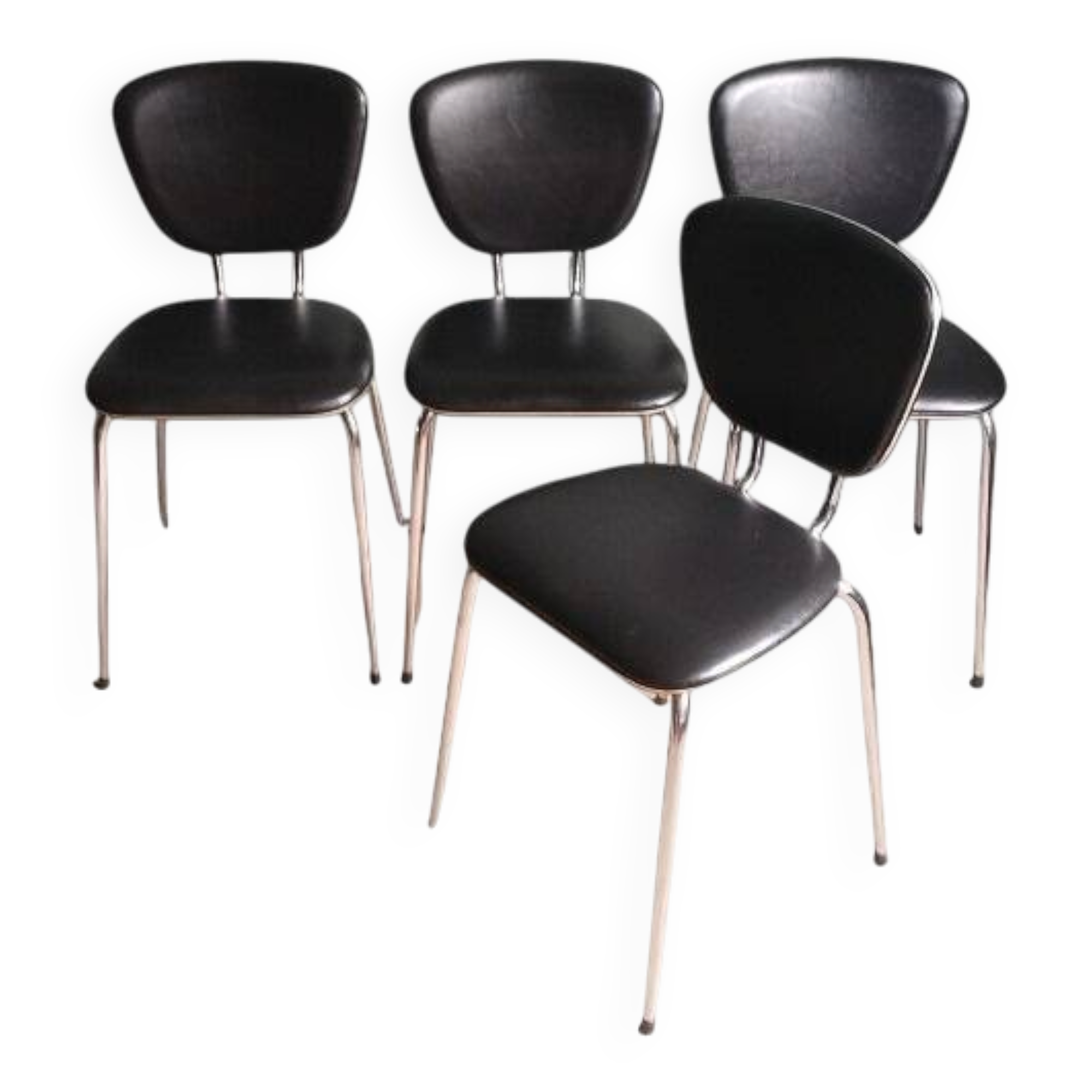 Set of 4 black synthetic leather chairs with pearlescent trim.