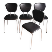 Set of 4 black synthetic leather chairs with pearlescent trim.