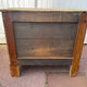 Raw wood chest of drawers with three drawers and shell handles.
