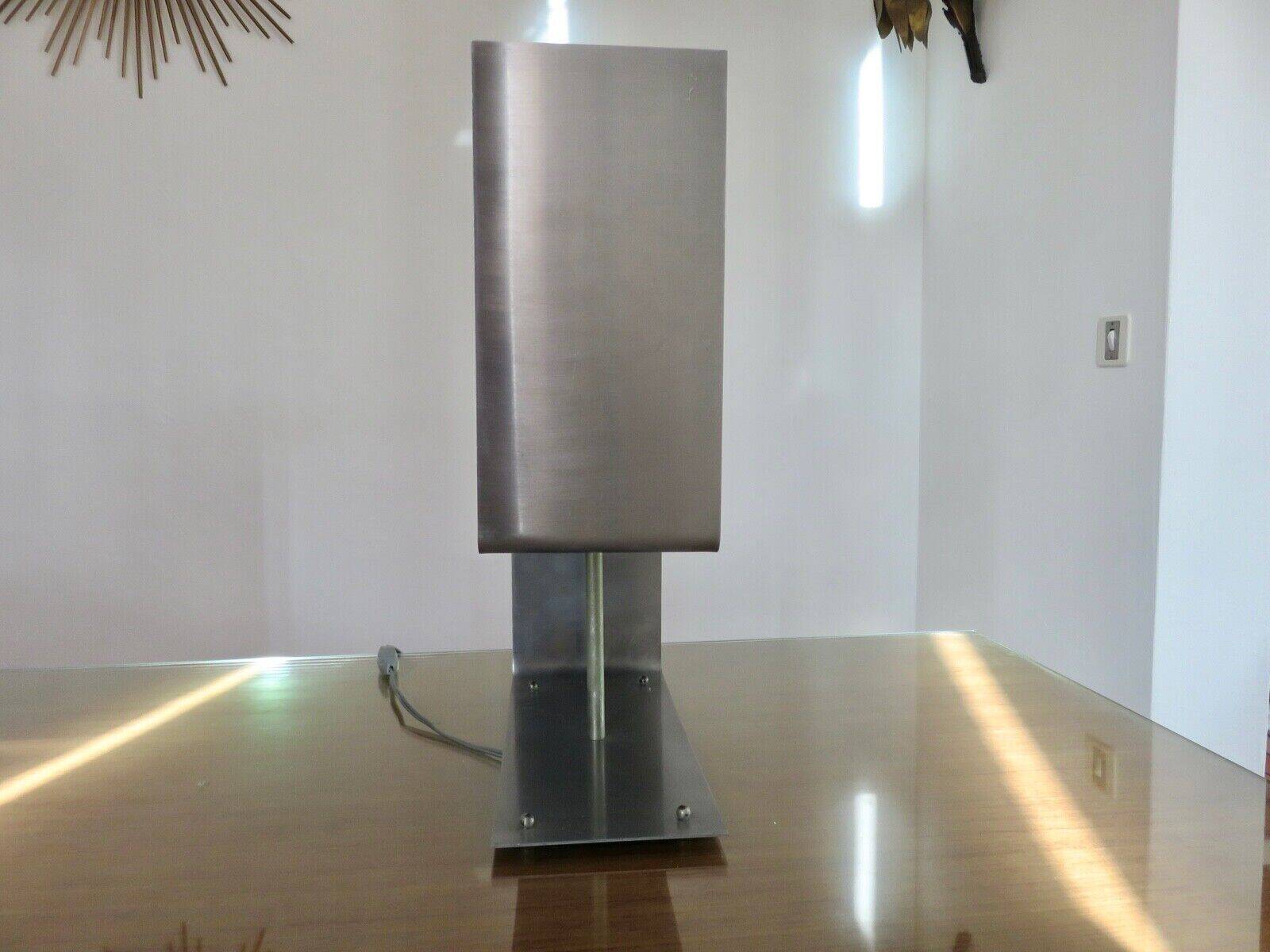 "uginox" lamp in folded, brushed and satin steel 1970