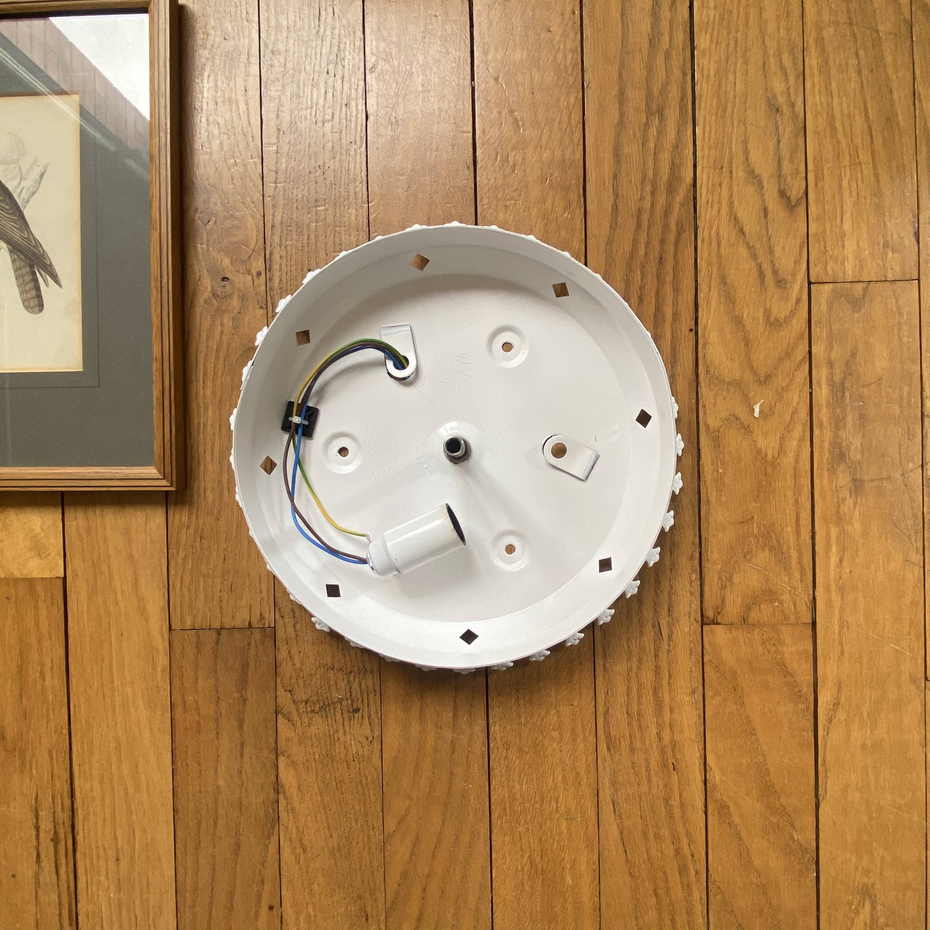 Antique ceiling light with transparent glass and white metal.