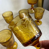 Six stemmed glasses in amber-colored molded glass