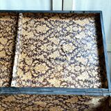 Trunk, black wooden chest and wallpaper