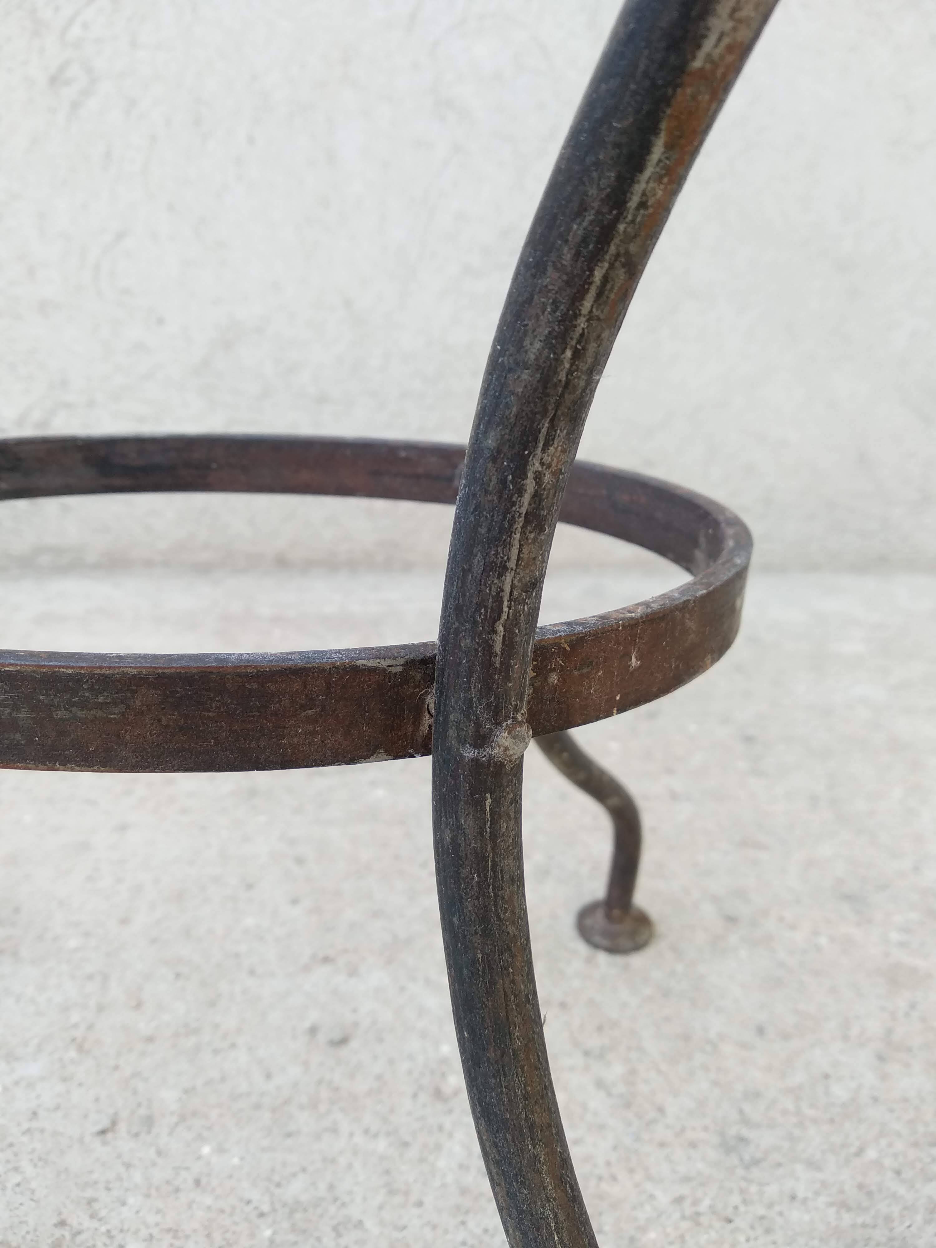 Antique bidet in enamelled sheet metal with wrought iron support