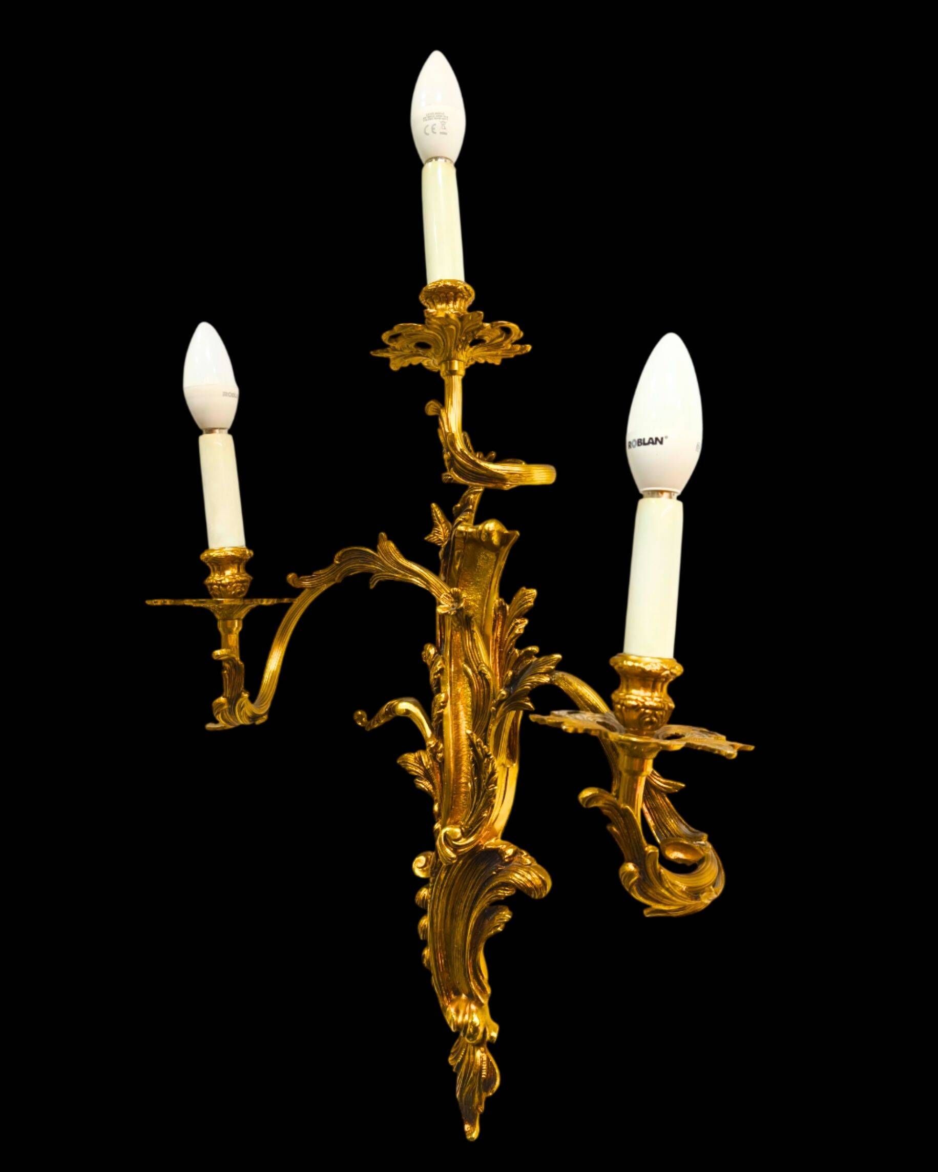 Pair of gilded bronze wall sconces in Rococo style, three lights.