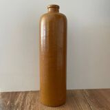 Old stoneware bottle with logo