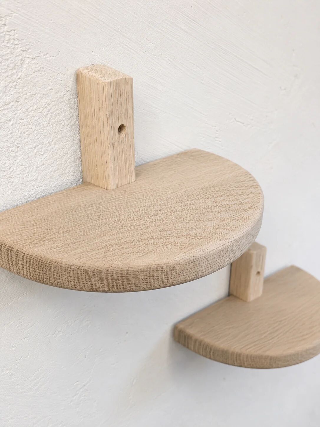 Pair of half-moon wall shelves in solid oak