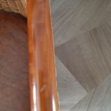 Armchair in woven rattan and exotic wood