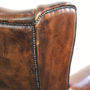 Vintage sheepskin wingback armchair in a deep brown colour finished