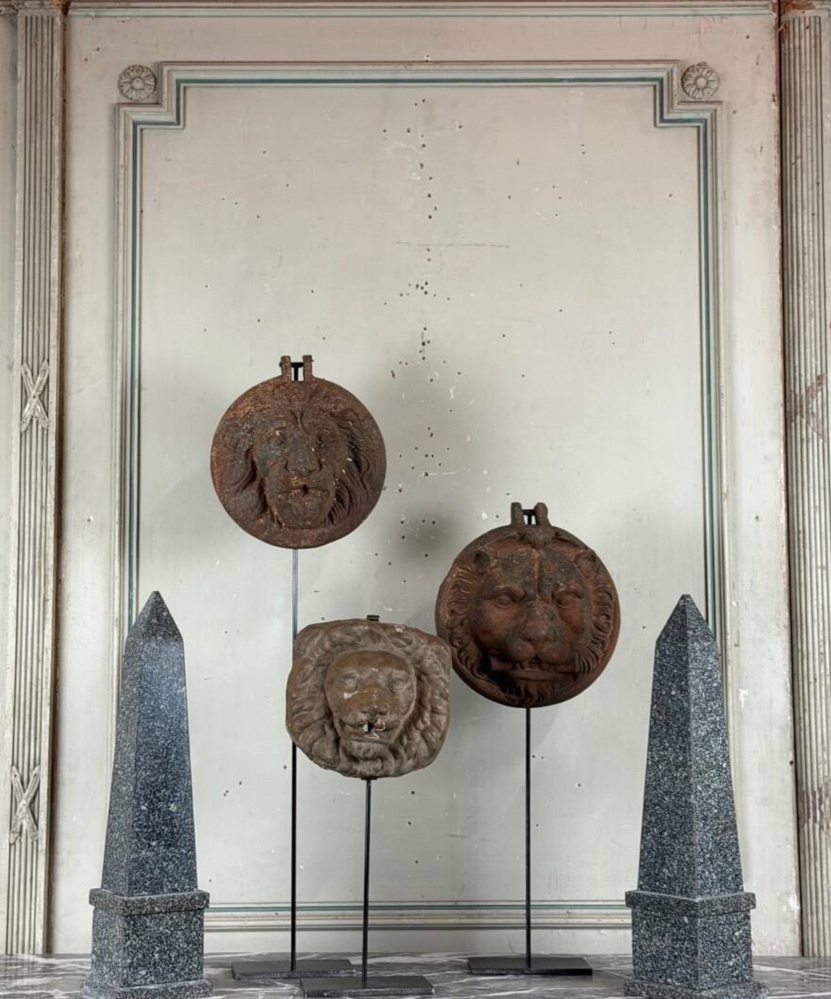 Three cast-iron and terracotta façade decoration lions, around 1880.