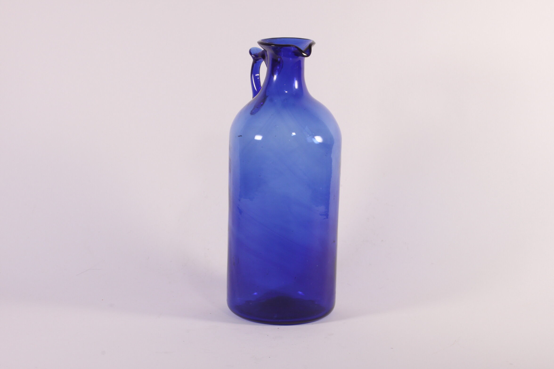 Antique handblown cobalt blue pitcher bottle, ca 1900.