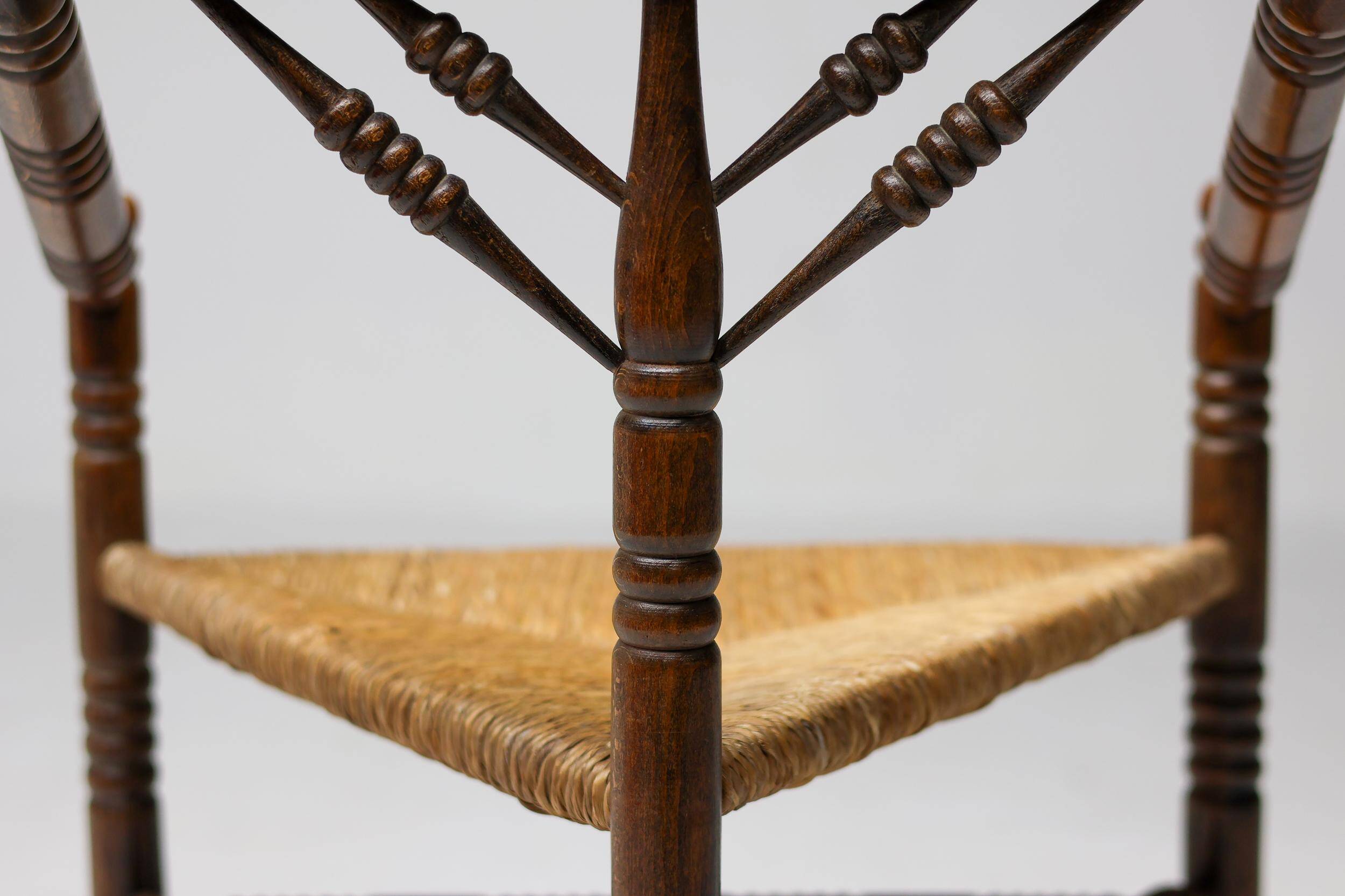 Mid Century Antiques spindle wood chaise with a rush seat.