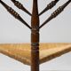 Mid Century Antiques spindle wood chaise with a rush seat.